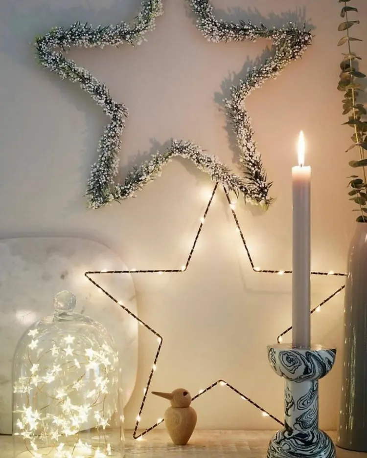 winterdeko mit lichterkette stern mit led umwickeln und wand dekorieren