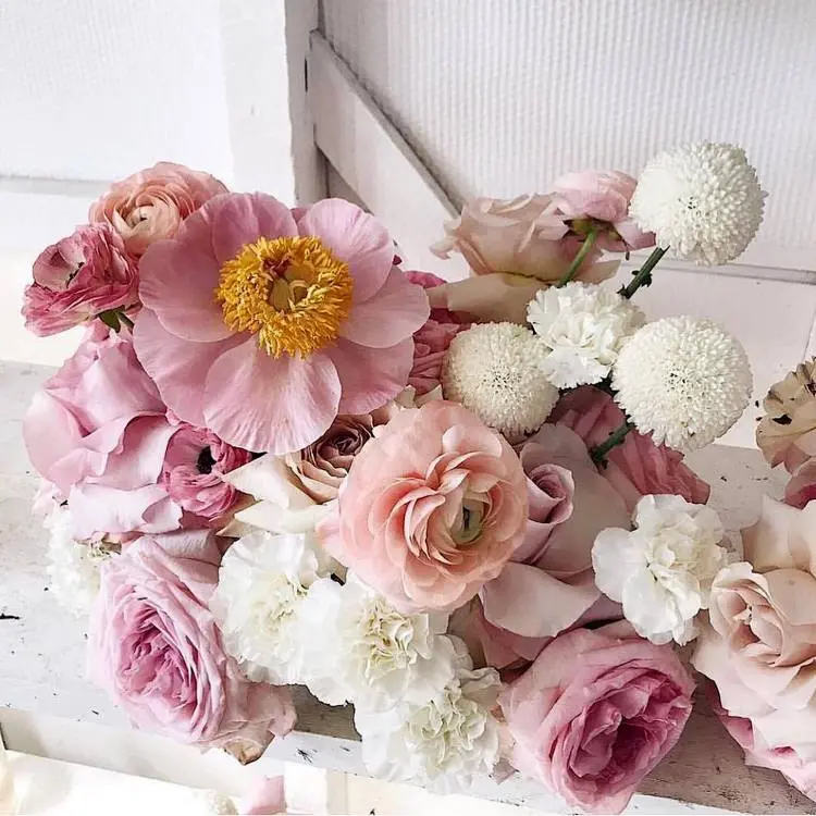 a romantic arrangement in spring or late summer with ranunculus