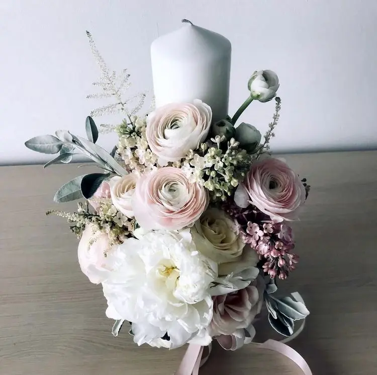 Decorate the baptism candle with pink ranunculus and white peonies