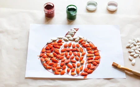 Kürbis basteln mit Kürbiskernen als Idee für Kinder