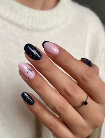 sehr stylishe schwarze fingernägel mit glitzer und french tips