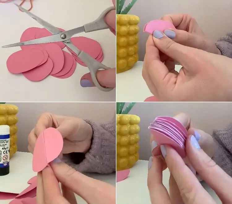 Aus Tonpapier Eier ausschneiden, in der Mitte falten und zusammenkleben