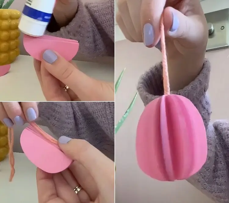 Schnur an der Kante festkleben und an den Osterstrauß hängen