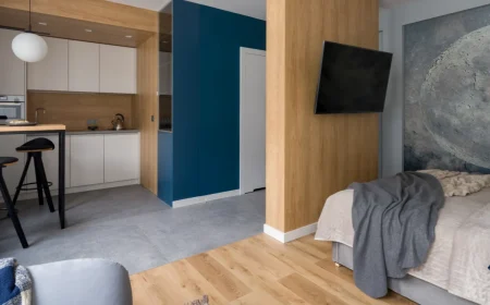 küche und schlafbereich in einem raum eingerichtet