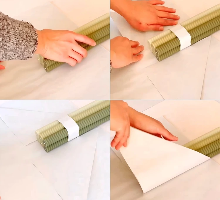 Stabkerzen auf dem Papier positionieren und die Ecken nach innen falten