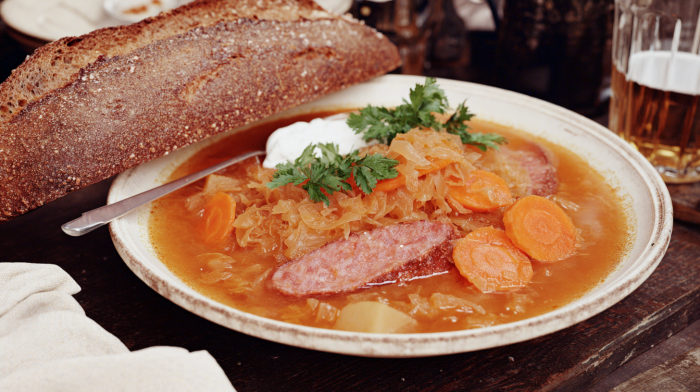 german sauerkraut soup served in a rustic ceramic bowl